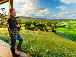 Stu Muir overlooking his family farm and beloved Waikato River, from the 'eco-lodge' they've built for others to enjoy, Aka Aka, Franklin (54042QF00)