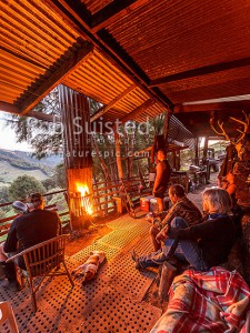 Hunters looking out over Makapua Station at end of the day from the Hunter's Camp. Colin and Marg Baynes at right, Wairoa, Wairoa (54074QF00)